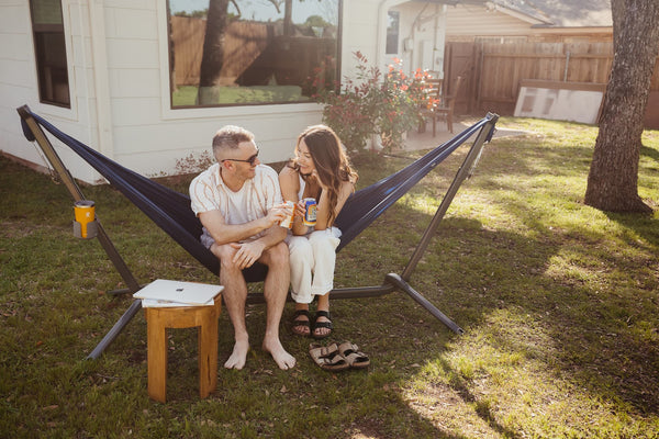 A couple sitted in a Roo Double in the house backyard.