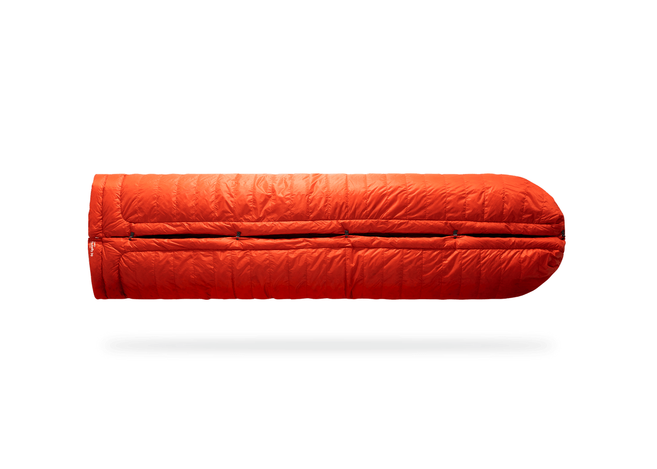 Studio Image of Kammok Trail Quilt Firebelly 30°F in Sleeping Bag Mode.