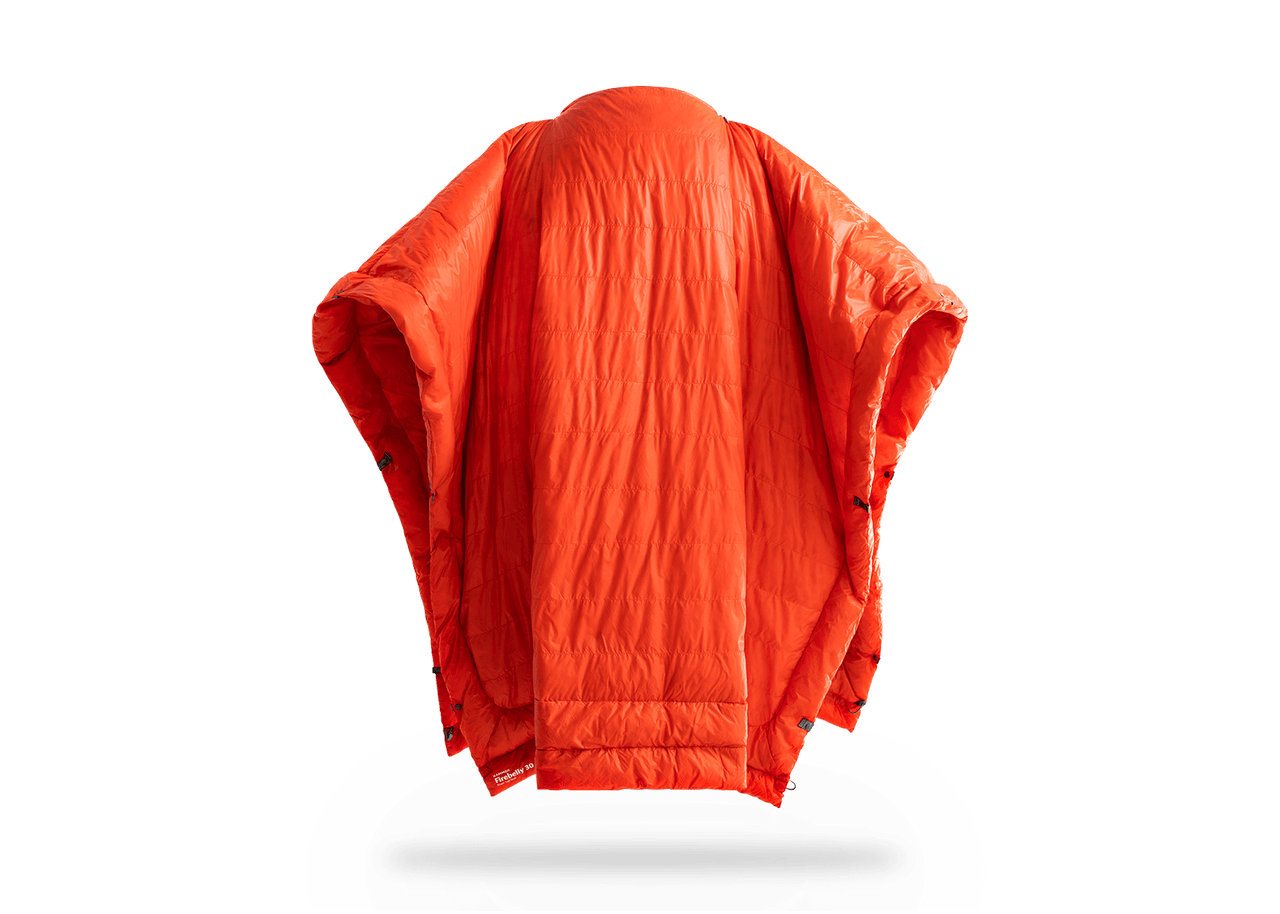 Studio Image of Kammok Trail Quilt Firebelly 30°F in Poncho Mode.