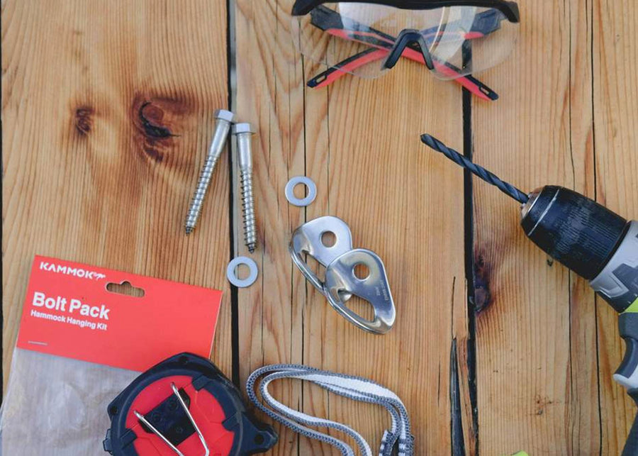 Kammok Accessory Bolt Pack with tools on wood deck.