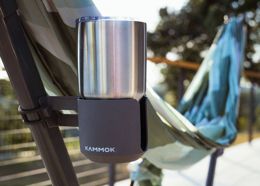 Swiftlet cup holder in granite gray attached in a Swiftlet portable hammock stand with a cup on it.