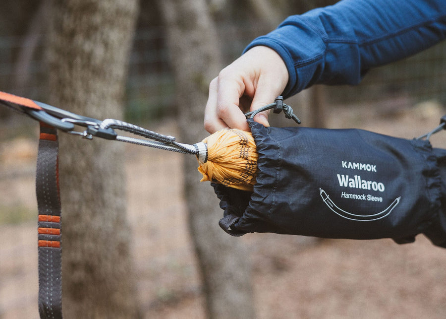 Close up of Man putting on the Kammok Wallaroo Hammock Sleeve