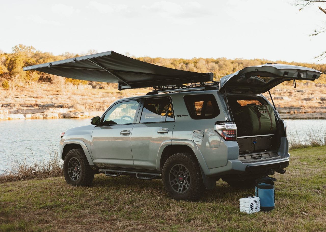 Crosswing awning installed on a Toyota 4Runner sitting next to river. Kammok Vehicle Parts & Accessories Crosswing