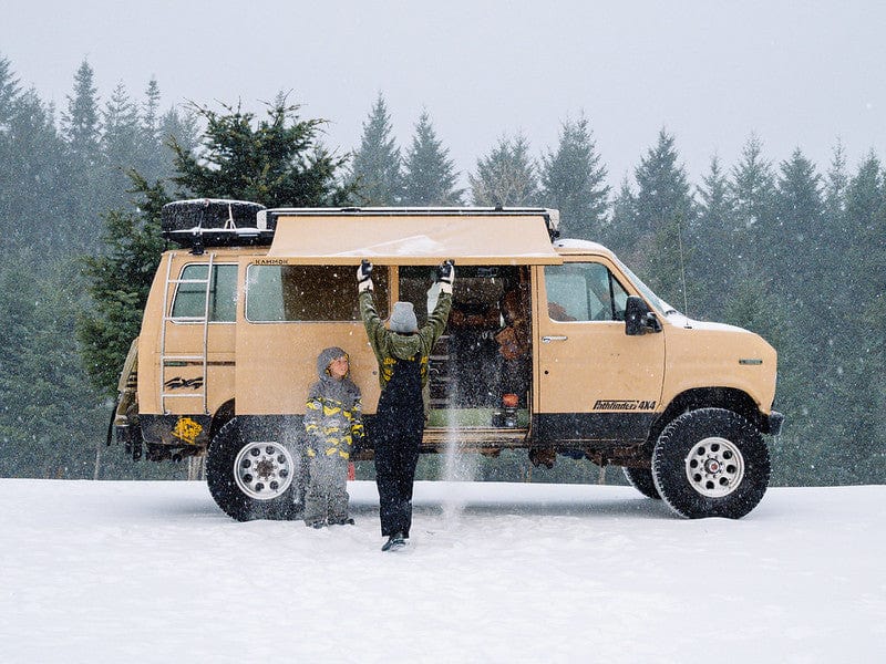 Women opening up Crosswing for shelter from snow. Stands Up to the Elements Crosswing’s unique X-Frame gives it the necessary support for heavy rains and can withstand winds up to 25 mph.