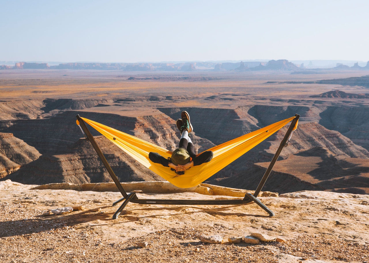 Woman relaxing at the top of the mountain on her Kammok Stand Swiftlet