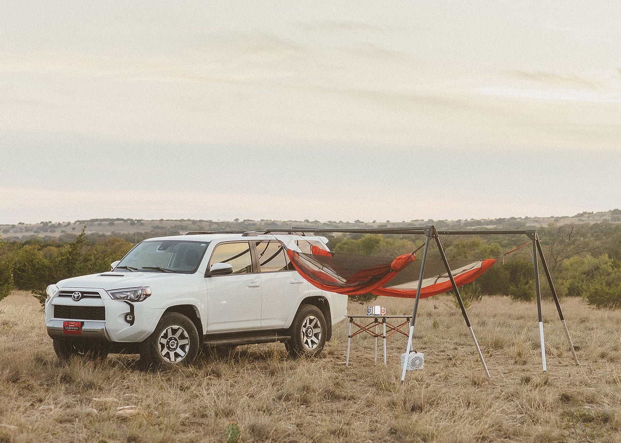 Toyota 4Runner in countryside with a Kammok Stand Outpost installed and two hammocks hanging. Relax in 60 Seconds