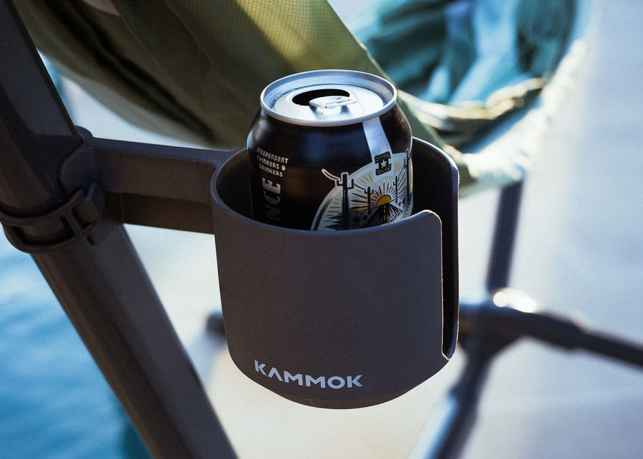 Black beer can sitting in Swiftlet Cup Holder attached to Swiftlet portable hammock stand.