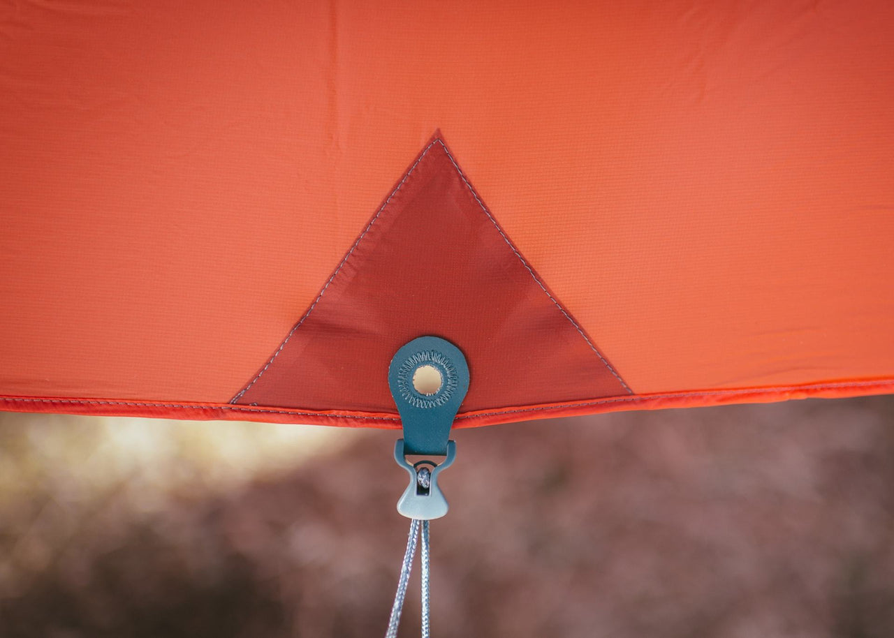 Close up of Kammok Weather Shelter Kuhli tie-down.