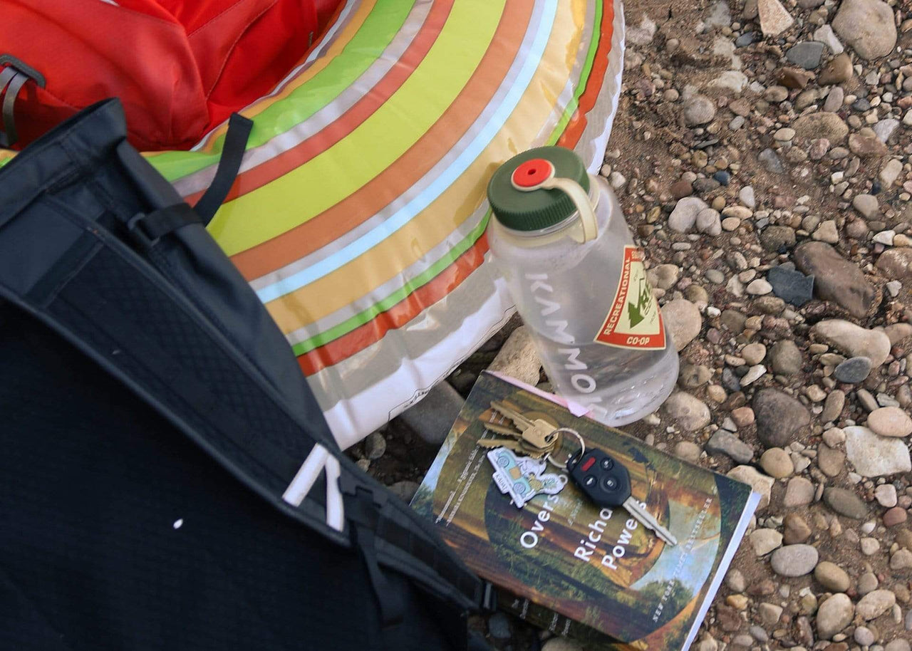 Water bottle in rocks with Kammok Logo sticker installed.