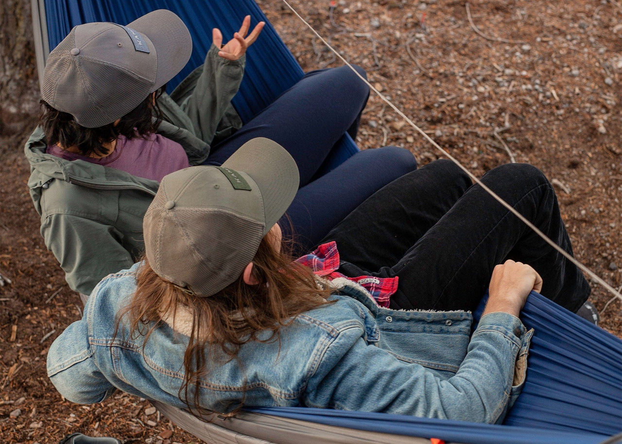 Girls sitting in a Kammok Hammock Tent Mantis