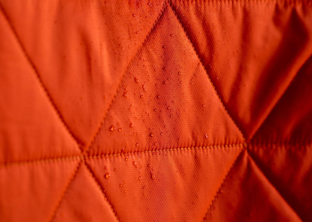 Close up of water drops being repelled on a Kammok Blanket Mountain Blanket