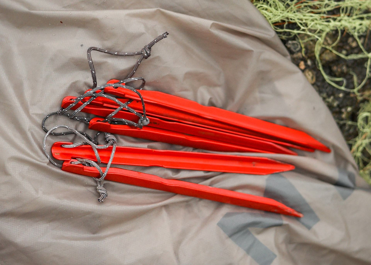 Kammok Accessory Stake Pack lying on tarp.